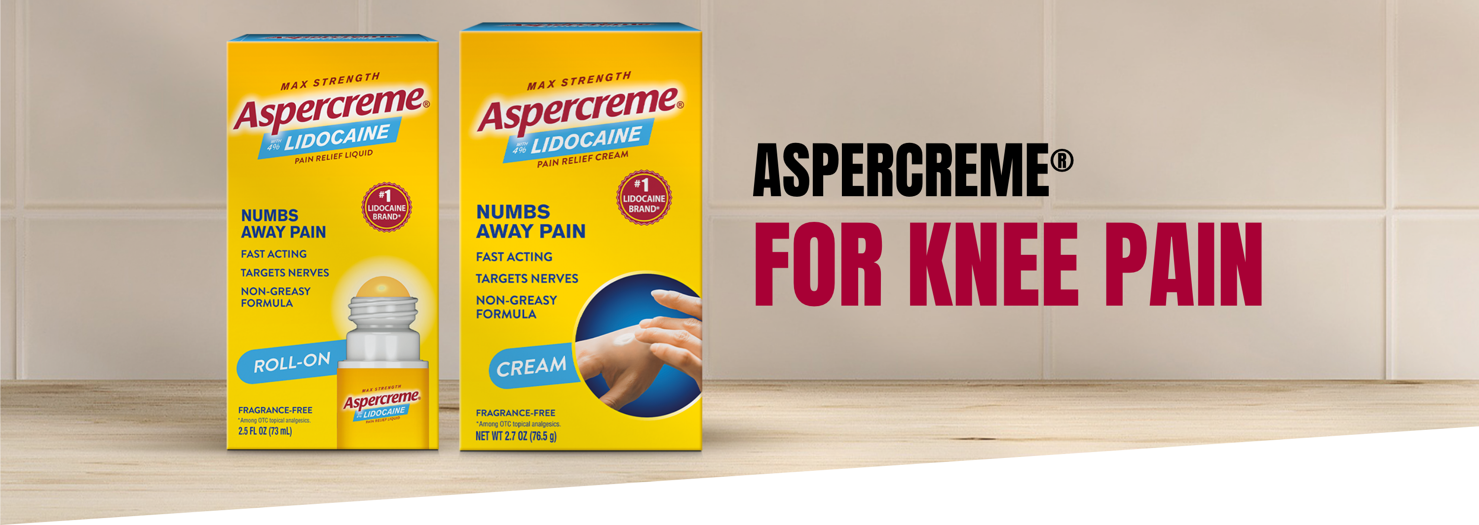 Aspercreme pain relief roll-on and cream are lined up on a countertop