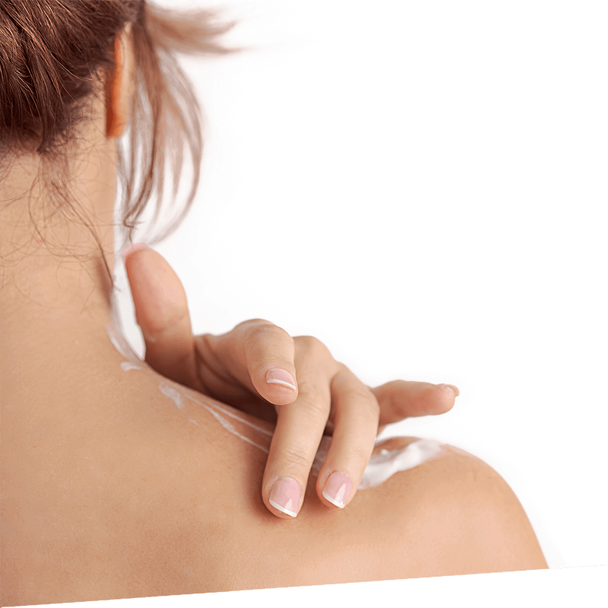 A woman runs cream into her shoulder.