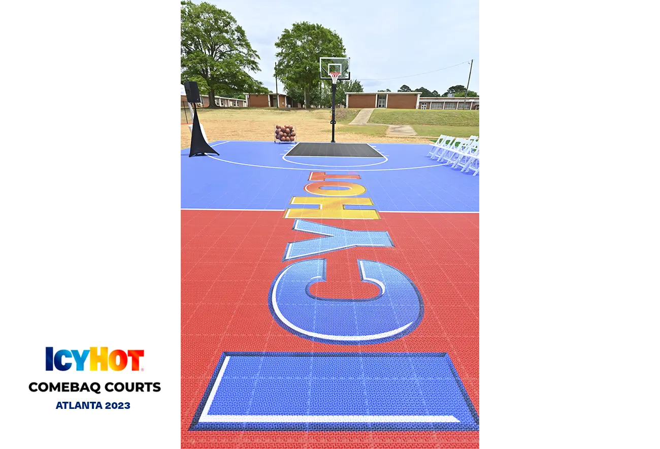 An image of the newly renovated basketball court in Atlanta, featuring the vibrant red and blue Icy Hot logo on the floor. In the lower-left corner of the image, a label displays the Icy Hot Comebaq Courts logo, along with the event's year (2023) and location (Atlanta).