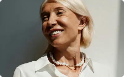 A close-up of a woman featuring natural skin texture and lines highlighting the renewal for aging skin category.